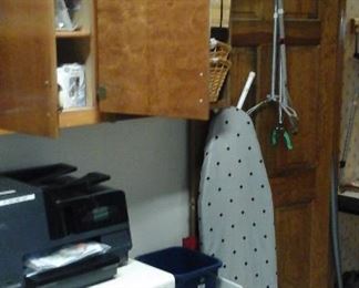 Ironing boards, wastebaskets, cleaning supplies. 
