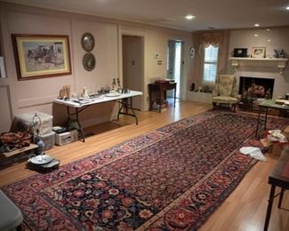 Hand-woven Persian rug from the 1800s, wing chairs, card tables, artwork
