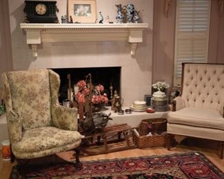 Vintage sleds from the 1930s, vintage wing back chairs, antique clock