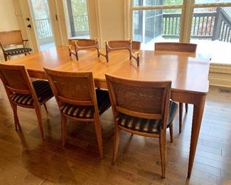 Mid century dining set by John Widdecomb ....includes table, three leaves, custom table pads, six side chairs and two captains chairs.