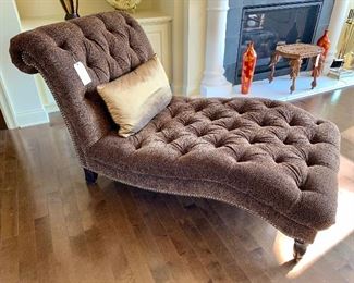 Animal print upholstered chaise.  Features animal print pattern and nailhead trim...like new!