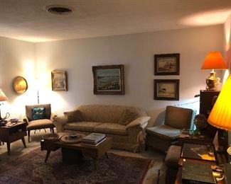 Speakers. Mcm furniture. Great coffee table books. Art. Pottery. Rug.
Lamps.