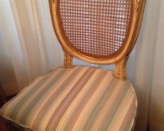 One of 6 cane back chairs