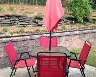 Umbrella table; 4 red chairs