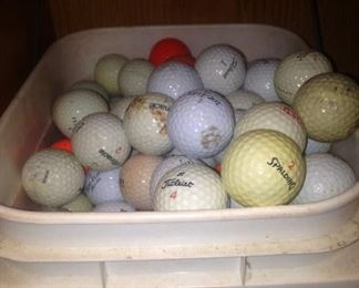 One of two large buckets of golf balls