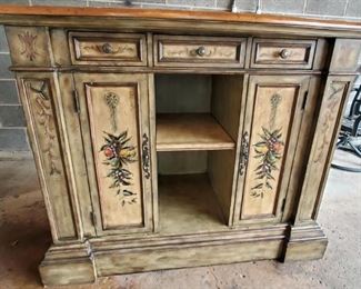 Hand painted wooden designer cabinet/bar
Wooden top
53" wide x 30" deep x 43" tall
3 front drawers
2 front cabinets with 2 adjustable shelves each
1 center adjustable shelf
2 adjustable shelves on each side
Solid wood
VERY Heavy $450