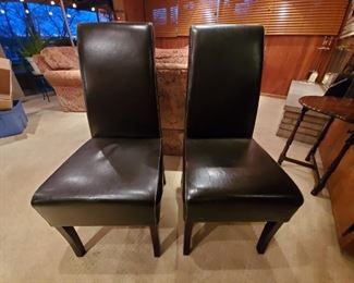 Two matching brown  leather chairs. $50 each