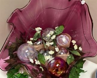 Exquisite hand-blown glass bowl that can add elegance to any table or wall for display. Made at the renowned studio of Ira Sapir. Colors - dark pink and clear glass, accented with light blue and touches of gold.  