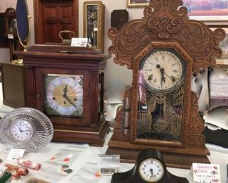 Howard Miller key wind and set carriage clock (rear left). Ingraham dial calendar clock with barometer (rear right). Mikasa quartz (Germany) (front left). Seth Thomas mantel clock (front right).