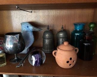 Plenty of decorative items, apothecary jars, pewter cans and more