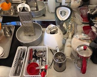 Large selection of kitchen utensils, gadgets and machines like hand held mixers, blenders, nut crackers, garlic presses, etc.