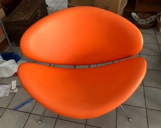 Funky modern orange chair.