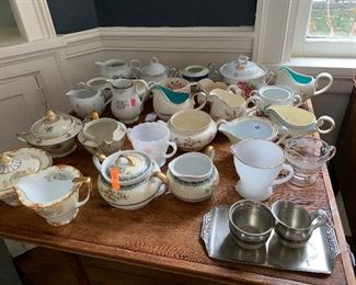 Assorted cream and sugars - china, metal, milk glass, glass. Some matching, some mismatched. 