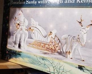 Santa with Sleigh and Reindeer Porcelain Figurines Set