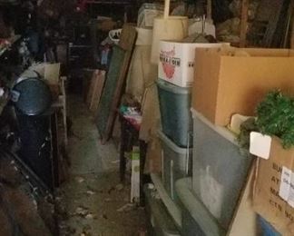 Bins and bins and shelves full of items in outbuilding 1