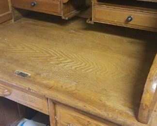 Midsize roll top desk, plastic table cloths, towels, sheets, new holiday decor.