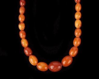 19: Amber Oval Bead Necklace 22" long, 20.5 grams