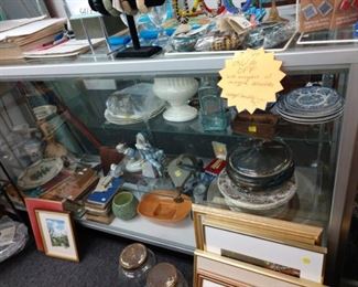 Items within display cases and artwork, jewelry 30-75% off depending on vendor; display cases for sale