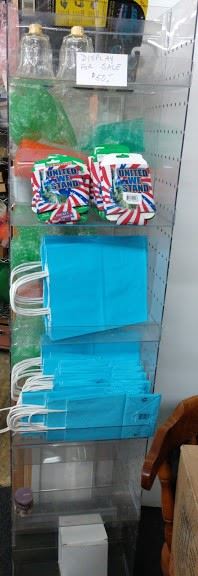Rotating display/shelving with pegboard sides (hooks available)