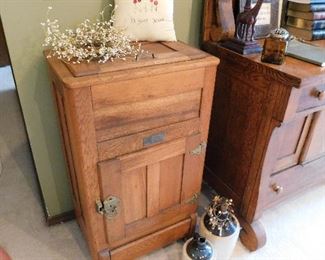 Awesome antique oak icebox in original condition including wooden casters