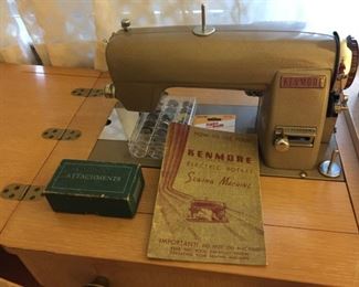 Vintage Kenmore Sewing Machine in cabinet.
