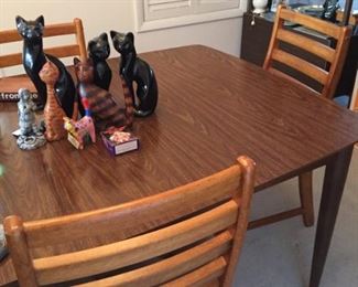 Dining room table and six chairs, plus an assortment of cats!