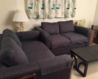 Matching love seat and sofa with coffee table. Several sets of fun curtains!
