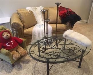Loveseat, glass & iron coffee table, vintage clothing and upholstered child's chair