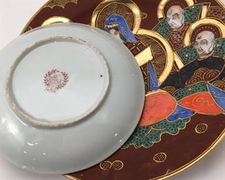 Beautiful tea cup, saucer and plate set with amazing detailed face in the bottom of the tea cup. China logo from Japan.