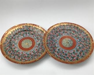 Set of two plates with tiny detailed painted people.