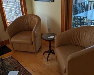 Sealed bid auction lot 007 pair of Natuzzi leather swivel club chairs in camel.  Original retail $750 each.