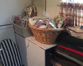 One of two craft tables, sewing notions and crafts