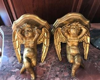 Pair of cherub wall shelves