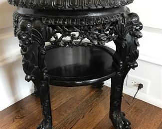 There are a pair of marble-top antique end tables (one table is slightly larger than the other).