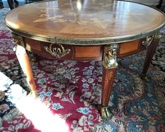 Round inlay coffee table with brass accents