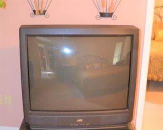 ONE OF NUMEROUS TVS AND STANDS