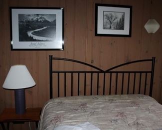 Full size bed - black metal head board. Two identical beds, one with like new mattress/boxspring (guest bed), one without.