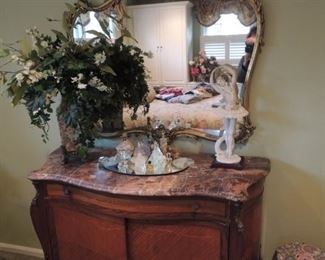 antique French marble top commode and antique mirror, Armani ballerina, floral arrangements
