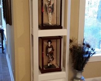 White display stand with vintage handcrafted Japanese figures in glass  cases