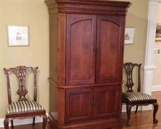 Large cherry armoire  and two Hepplewhite ball & claw chairs