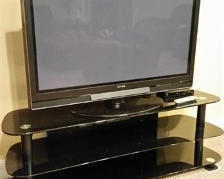Hitachi 50 inch plasma TV and black TV stand