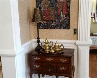 Queen Anne style cherry lowboy and small tapestry