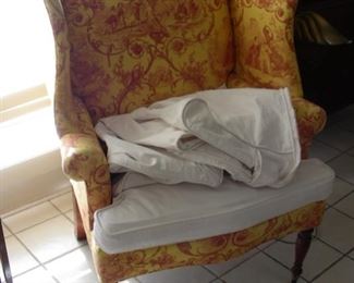 One of two wing chairs - look at the fabric under the slipcover!