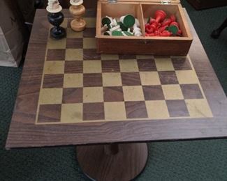 antique chess table with playing  pieces