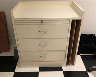 Desk with multiple drawers for art and supplies.