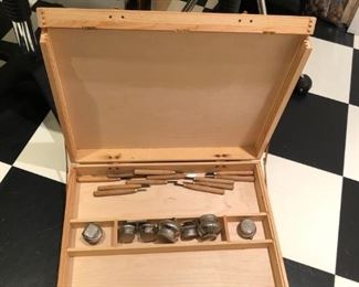 Traveling easel and paint tools.