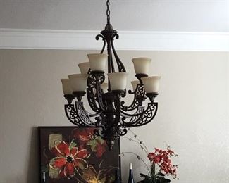 Buffet with mirrored glass; Oil rubbed bronze chandelier; artwork