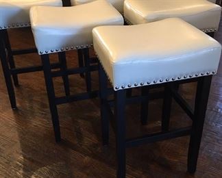 Six bar stools in white leather with nail head trim
