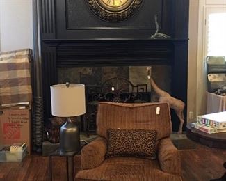 Chair and ottoman, contemporary lamp, custom faux mink throw, mantle clock, custom drapes, area rug 
