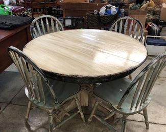 Super cute painted cottage style pedestal table and four chairs.